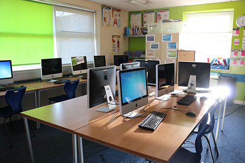 IT classroom equipped with computers and desks