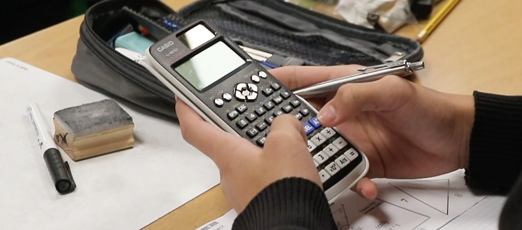 Kennet School pupil using a calculator during a mathematics lesson