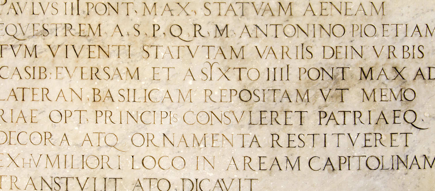 Ancient Latin inscription carved into a stone surface