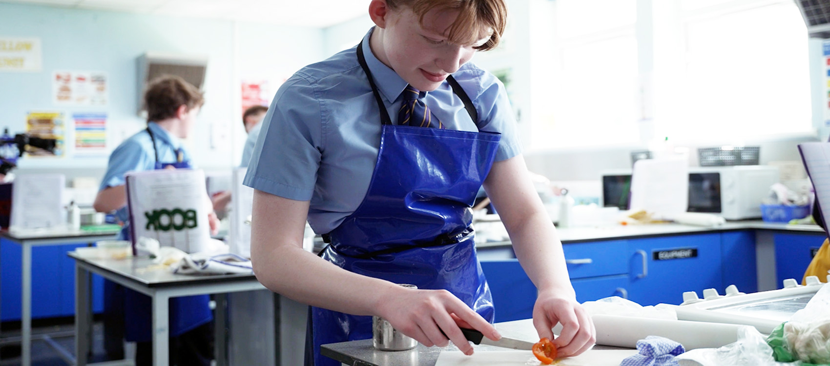 Kennet School pupil participating in a cookery class