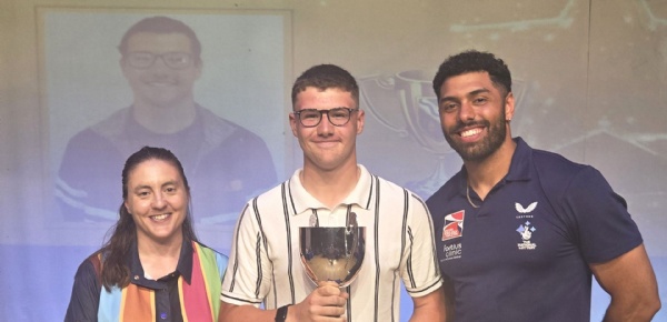 Kennet Sports Personality of the Year holding trophy, standing between the Headteacher and Leon Greenwood of  British Bobsleigh fame.