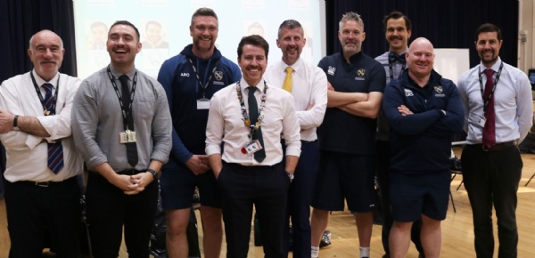 Members of male staff after they have had their beards shaved for Movember charity event