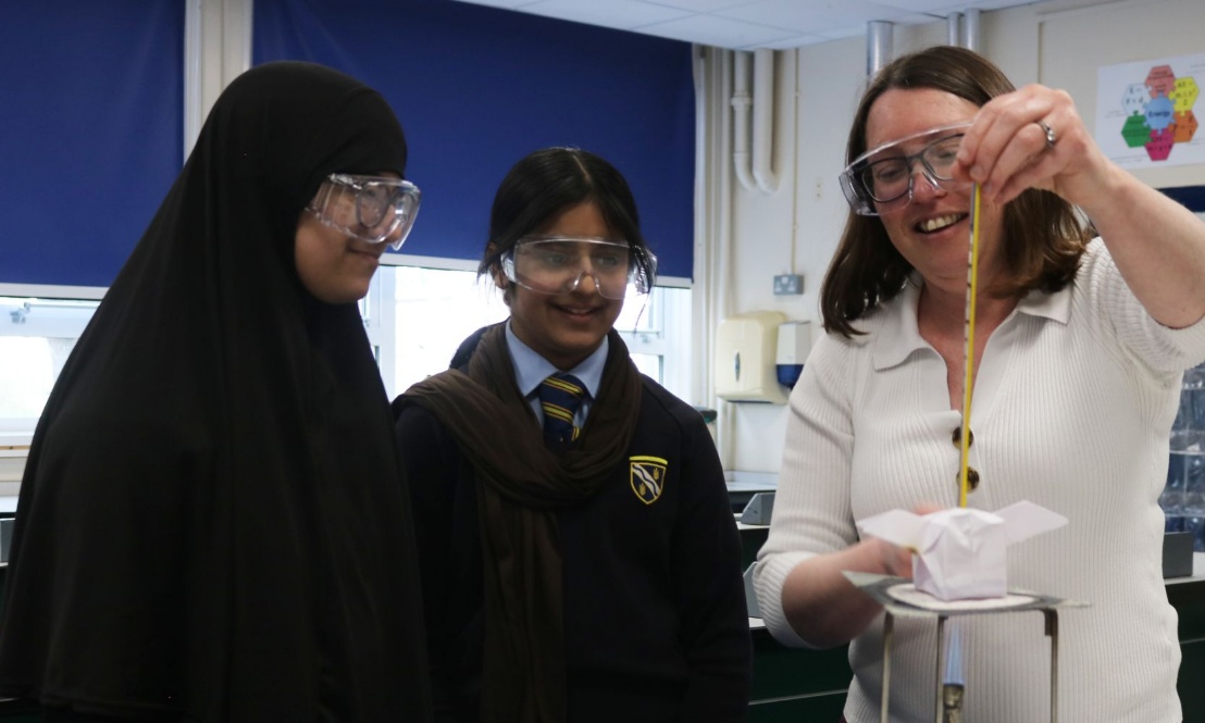 Two pupils with the Head of Science during an experiment